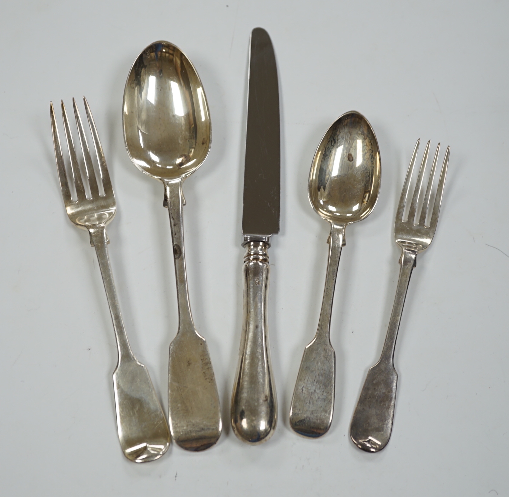 A harlequin part canteen of mainly 19th century silver fiddle pattern flatware, various dates and makers including set of six tablespoons by Aldwinckle & Slater London 1883, one other set by Henry Holland, London, 1861 a